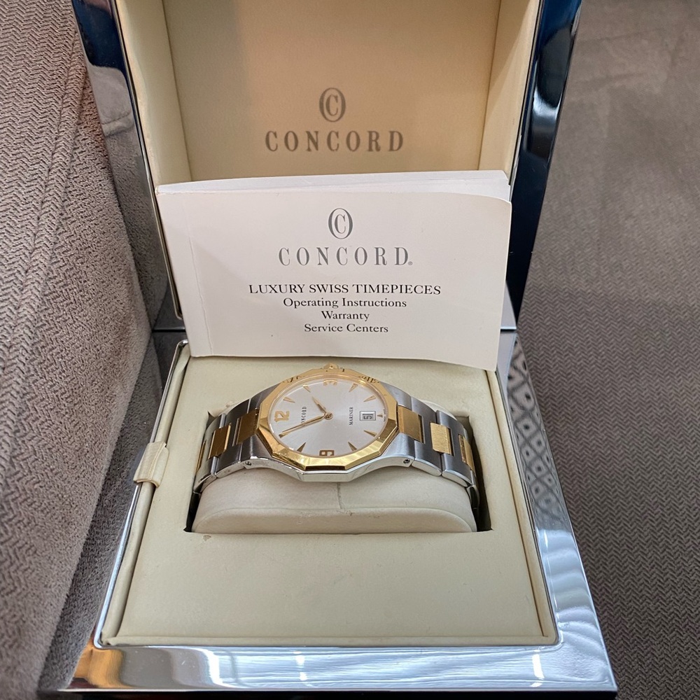 Men's 18 karat gold, and stainless steel Concorde wristwatch original box papers